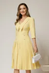 Rochie DY Fashion galbena cu decolteu cu guler ascutit si fusta plisata