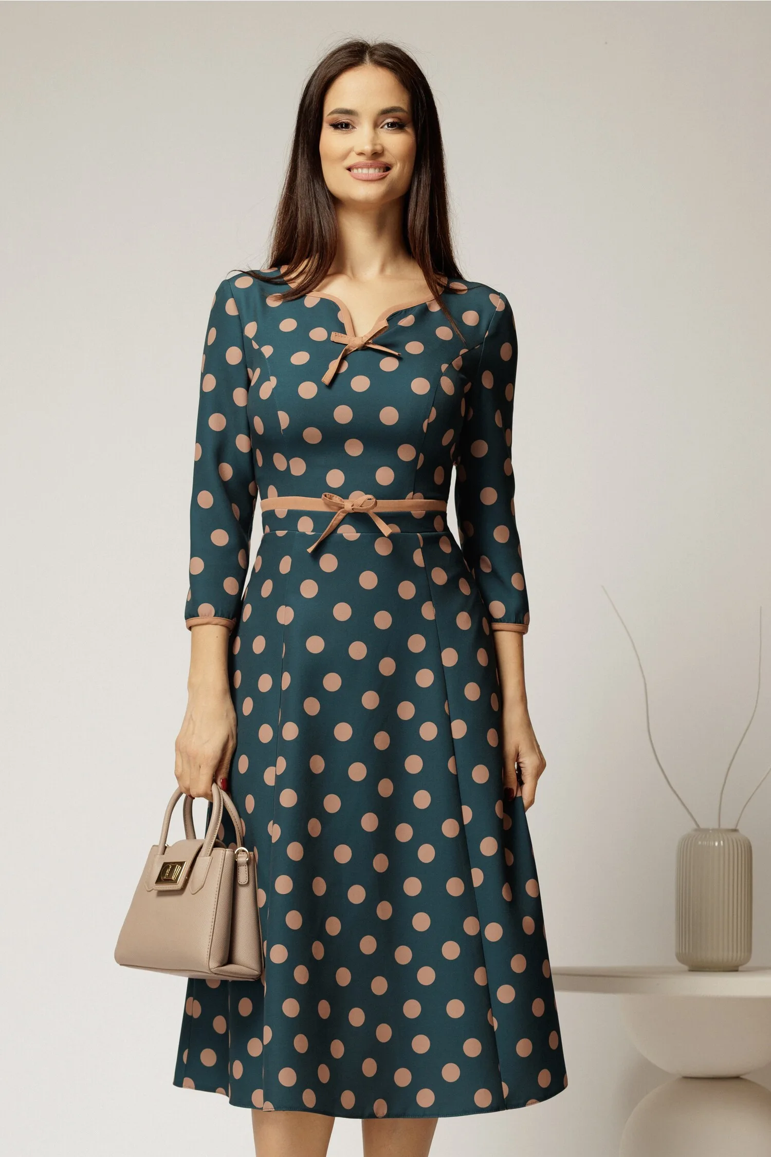 Rochie DY Fashion turcoaz cu buline cu decupaj si funda la decolteu