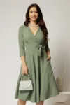 Rochie Dy Fashion verde fistic cu decolteu petrecut si funda maxi