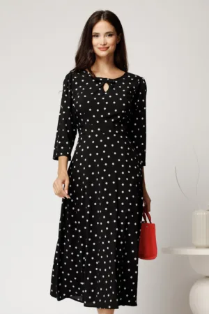 Rochie midi neagra cu buline din viscoza in clos cu funda si decupaj la decolteu