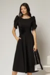 Rochie midi neagra de ocazie cu aplicatie in talie cu margele si maneci decupate