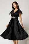 Rochie midi neagra din tafta cu pene la umeri si cordon in talie