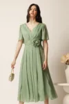 Rochie midi verde deschis din voal clos cu floare in talie- Moze