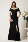 Rochie neagra lunga din stofa cu decolteu barcuta si crapatura pe picior- LaDonna