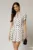 Rochie DY Fashion alba cu buline negre cu fusta scurta cu pliuri si decolteu