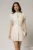 Rochie DY Fashion alba cu buline roz cu fusta scurta cu pliuri si decolteu
