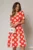 Rochie DY Fashion corai cu buline mari si pliuri ample in contrast