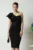 Rochie DY Fashion de ocazie din stofa neagra cu un umar gol si catarama in talie