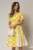 Rochie DY Fashion galbena cu buline mari si pliuri ample in contrast