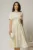 Rochie DY Fashion ivoar unt cu funde pe bust si maneci scurte