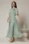 Rochie DY Fashion lunga verde menta din voal cu fir lurex in clos cu accesoriu la bust