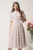 Rochie DY Fashion midi alba in clos din triplu voal cu floricele roz si curea in talie