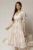 Rochie DY Fashion midi din triplu voal cu print roz galben si guler ascutit si nasturi la maneci