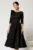 Rochie DY Fashion midi neagra din stofa in clos cu floare la bust