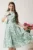 Rochie DY Fashion midi vernil in clos din triplu voal cu floricele si curea in talie