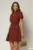Rochie DY Fashion scurta caramizie cu nasturi decorativi la bust si pliuri pe fusta
