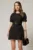 Rochie DY Fashion scurta neagra cu buzunare pe fusta si maneci scurte