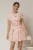 Rochie DY Fashion scurta roz cu floricele si fusta cu pliuri