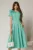 Rochie DY Fashion verde clos cu trandafir la umar si cordon detasabil