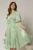 Rochie DY Fashion verde fistic cu decolteu adanc si nasturi din voal peliculizat