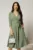 Rochie Dy Fashion verde fistic cu decolteu petrecut si funda maxi