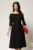 Rochie Irene midi neagra in clos cu umerii goi si funda la bust