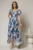 Rochie asimetrica din satin cu imprimeuri albastre si decolteu petrecut