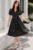 Rochie de zi neagra Ayana in clos cu buline albe