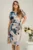 Rochie din panza bej cu imprimeuri bleumarin si cordon in talie