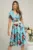 Rochie din viscoza bleu cu flori rosii si curea in talie