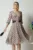 Rochie eleganta din voal bej cu buline si dantela in talie