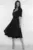 Rochie eleganta neagra din material vaporos cu croi in clos si buzunare laterale