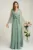 Rochie lunga de ocazie din tull verde fistic cu floare in talie