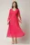 Rochie lunga fucsia din voal creponat in clos cu maneci despicate
