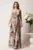 Rochie lunga ivory cu flori colorate din satin in clos cu fusta petrecuta si crapatura- LaDonna
