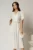 Rochie midi alba de ocazie cu pliuri pe bust si cordon detasabi cu flori