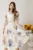 Rochie midi alba din viscoza cu flori mov in clos cu maneci scurte