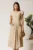 Rochie midi bej din material fluid in clos cu trandafiri pe buzunare