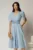 Rochie midi bleu de ocazie cu pliuri pe bust si cordon detasabi cu flori