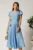Rochie midi bleu din material fluid in clos cu trandafiri pe buzunare
