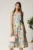 Rochie midi bleu din viscoza cu imprimeuri galbene in clos cu floare in talie
