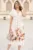 Rochie midi din in alba cu imprimeuri florale maro la baza si cordon in talie