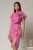 Rochie midi fucsia conica cu volanase si floare ampla pe umar