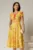 Rochie midi galbena de zi cu imprimeuri forale si volanase la maneci