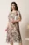 Rochie midi gri din voal in clin cu imprimeu floral roz si volane la baza