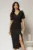 Rochie midi neagra conica cu decolteu V si floare in talie