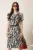Rochie midi neagra din viscoza in clos cu imprimeuri albe si curea in talie