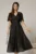 Rochie midi neagra din voal cu fir lurex si floare la umar