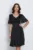 Rochie midi neagra din voal in clos cu insertii din fir lurex si volan la bust