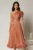 Rochie midi roz coniac din voal peliculizat cu volanase pe fusta